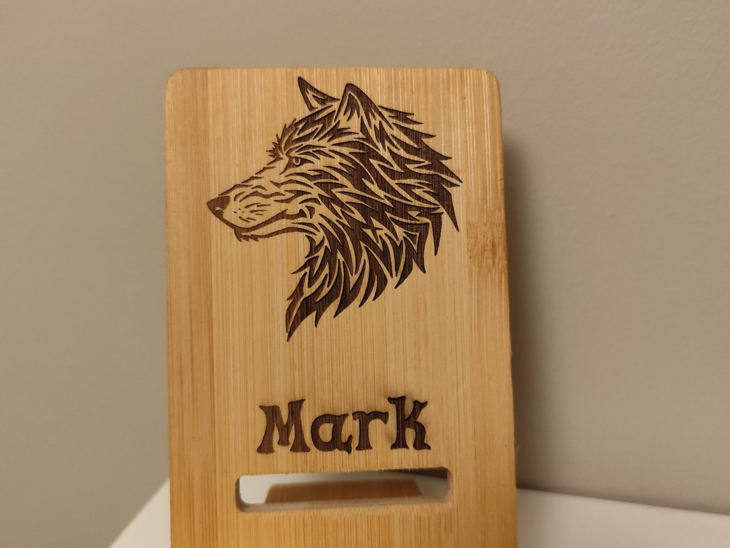 Personalized Phone Holder – Wooden Stand with Wild Wolf Engraving